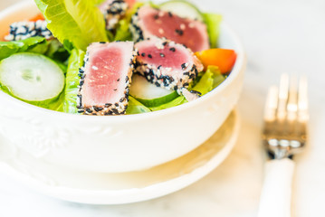 Grilled tuna salad in white bowl - healthy food