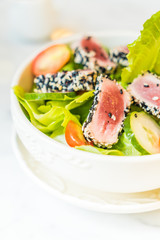 Grilled tuna salad in white bowl - healthy food