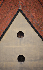 Roof tiles of a  building with holes