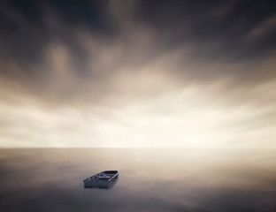 Fototapeta na wymiar Lonely boat in the sea