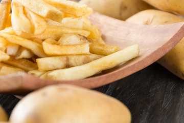 french fries on wood background