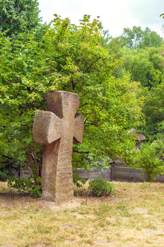 old Ukrainian stone cross on the outskirts of the villages