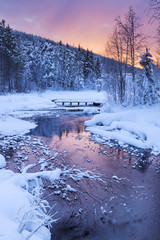Sunrise over a river in winter near Levi, Finnish Lapland - 90977338