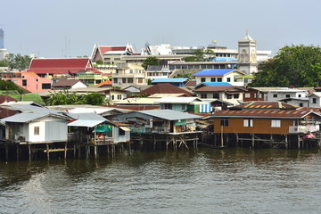 Fototapeta na wymiar Bangkok,Thailand-September 6 2015;Riverside slums in Chao Phraya River
