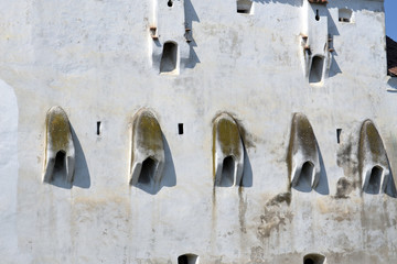 Old fortified wall with shooting holes