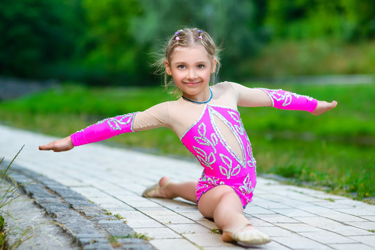 flexible little girl doing gymnastics split