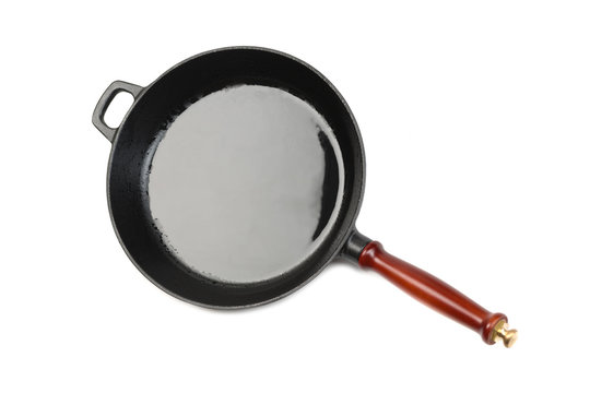 empty frying pan on wooden background