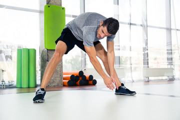 Fitness man warming-up at gym