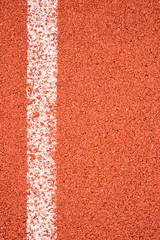 Running track with white line texture.
