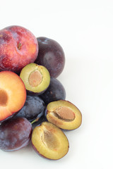 Closeup of ripe plums isolated on white.