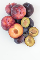 Closeup of ripe plums isolated on white.