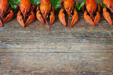 Boiled crayfish on a wooden background. - obrazy, fototapety, plakaty