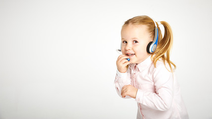 Young cheerful female customer support operator with headset and
