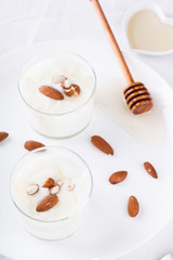 Homemade yogurt with honey and almonds.selective focus