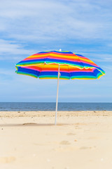 Fototapeta na wymiar Colorful sunshade sunny beach