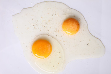 raw egg on white marble top table.