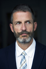 portrait of handsome businessman looking to the side