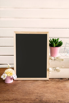 Shelf decoration with blackboard and flower on white background