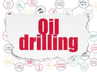 Manufacuring concept: Oil Drilling on Torn Paper background