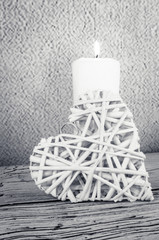 burning candle and heart symbol