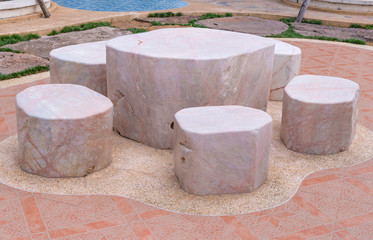 Marble stone garden bench in the public park