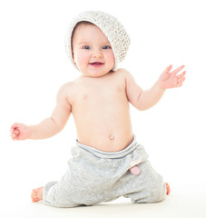 Dancing baby. Сheerful baby in the hat. Beautiful happy baby .