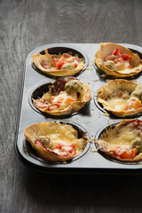Mini pizza on dark background
