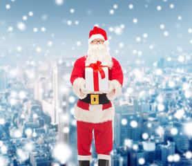man in costume of santa claus with gift box