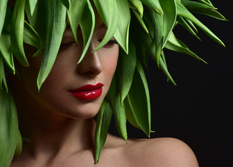 Beauty Spring or Woman with Fresh green leaves hair. Summer Natu