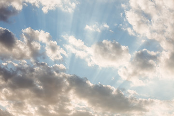 Clouds and sunrays at sunrise