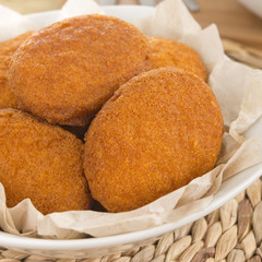 Acaraje - Traditional Brazilian fritters made with black-eyed peas and onions deep fried in palm oil (dende). Typical food from Bahia. Close up.
