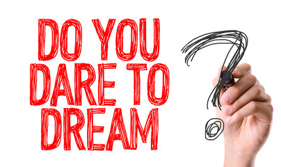 Hand with marker writing the question Do You Dare to Dream?