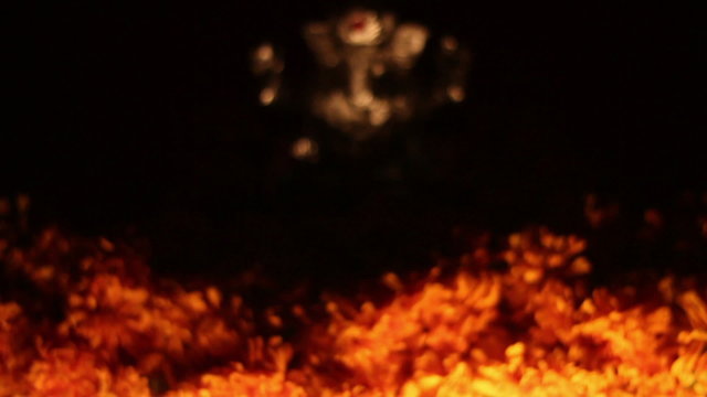 Lord Ganesha with glowing clay oil lamps and flower