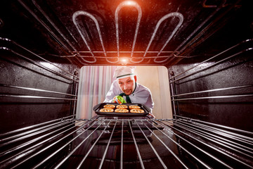 Chef cooking in the oven.