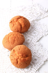 fresh homemade cupcakes on a white wooden background lace soft selective focus