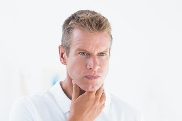 Concentrated doctor looking at camera