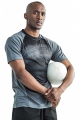 Portrait of confident sportsman with rugby ball