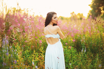 Fototapeta na wymiar Beautiful girl on the lavender field