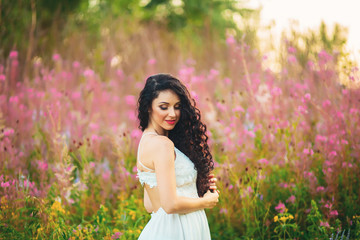 beautiful woman with long hair in field