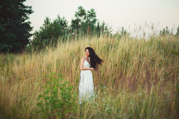 beautiful young woman in a field
