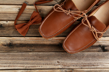 Fashion brown shoes on the wooden table