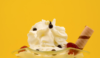 ice cream in a glass beautiful closeup on a yellow background