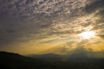 Fototapeta na wymiar sunset sky scape and cloud and mountain silhouette