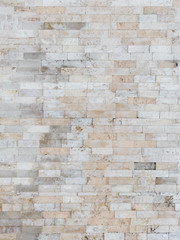 Beige wall made of natural travertine