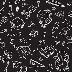 Creative seamless school pattern with calk drawings on blackboar