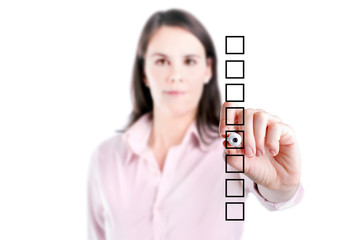 Business woman writing on some blank checklist boxes.