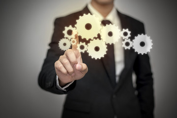 Close up of businessman touching digital screen with finger