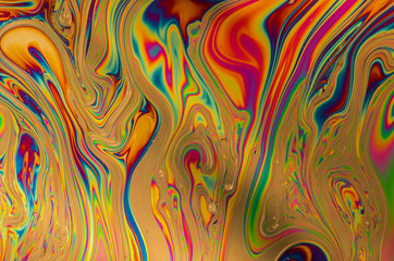 Multicolored soap bubble abstract background formed by light reflecting off the surface of a soap film