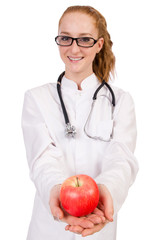 Pretty female doctor with stethoscope and apple isolated on whit