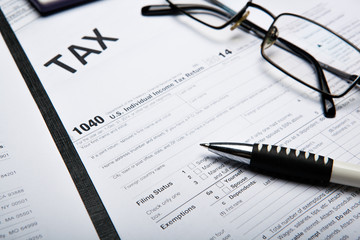 filling tax return on desktop